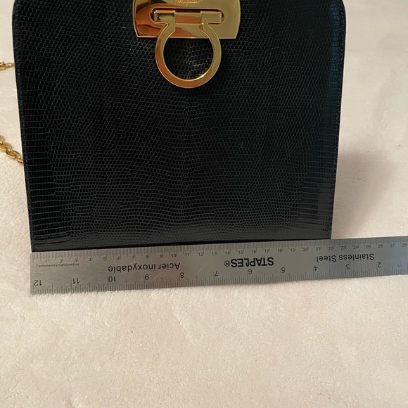 Authentic Salvatore Ferragamo black leather bag with shiny gold metal handle. - Picture 8 of 11